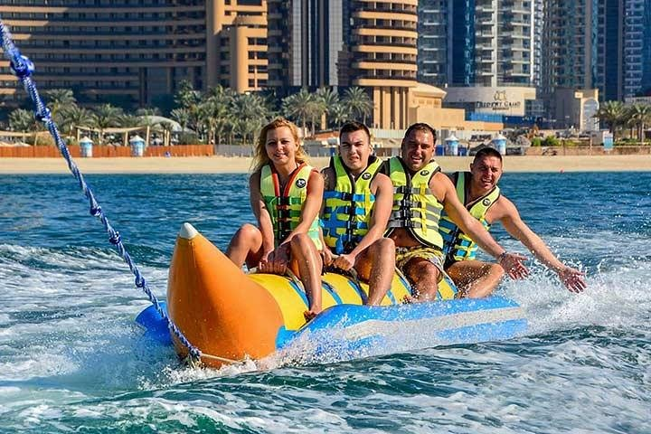 Experience the excitement of an inflatable ride through the stunning waters of Dubai Marina where families create unforgettable memories amid breathtaking views and exhilarating fun.